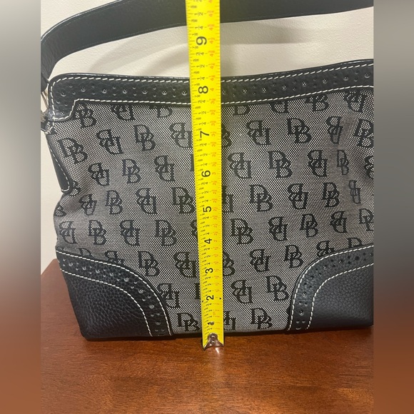 Dooney & Burke black logo printed fabric with black pebbled leather accents. - Picture 3 of 9